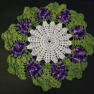 Vintage Crocheted Doilie of  RaisedGrape Clusters Green Leaves and White Center.